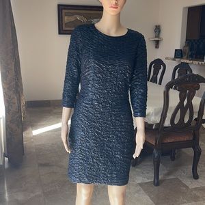 Black shimmered mini dress from ruched polyester fabric. Very sleek design.